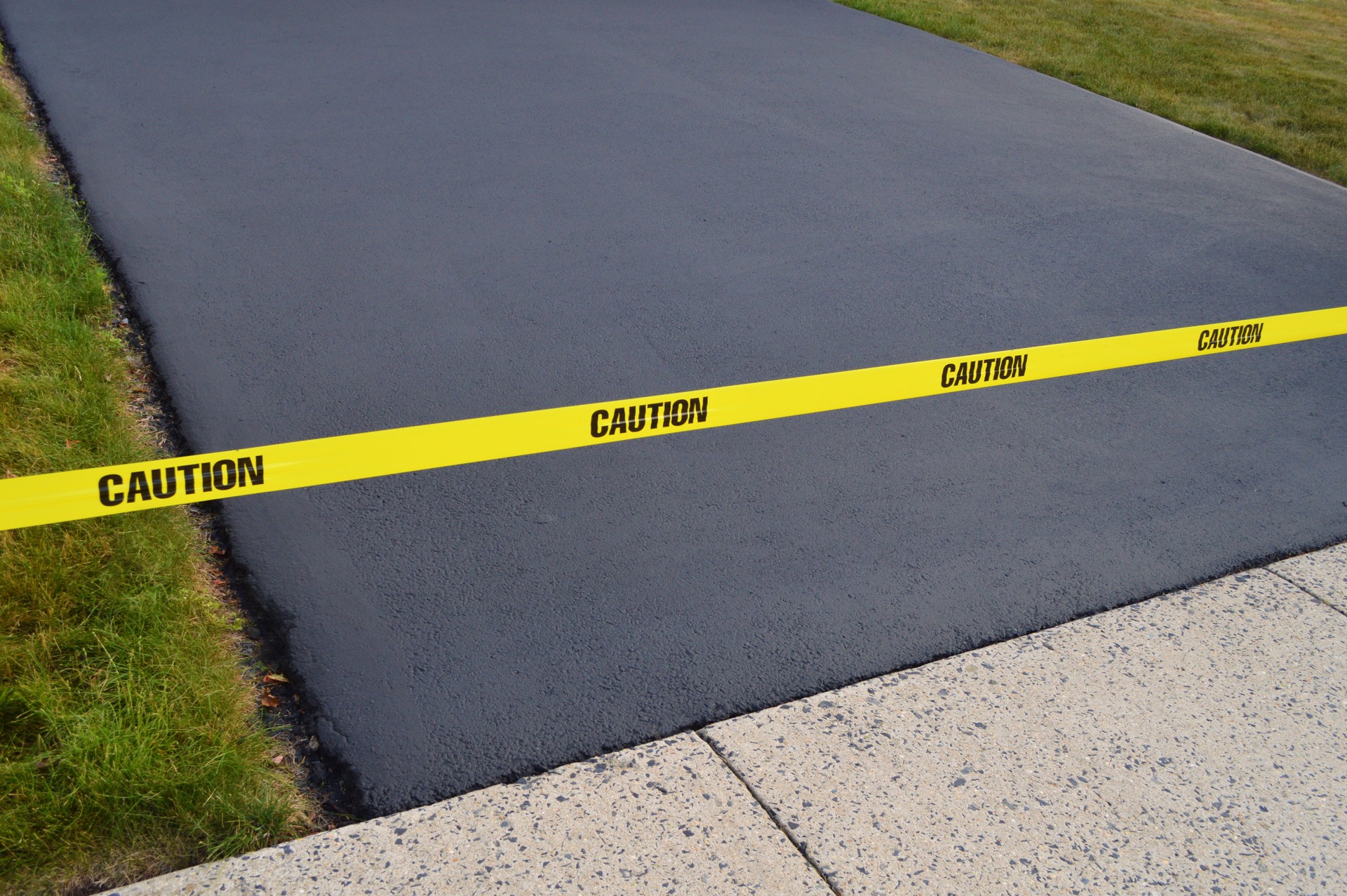 Fresh Seal Coated Driveway Meets Sidewalk